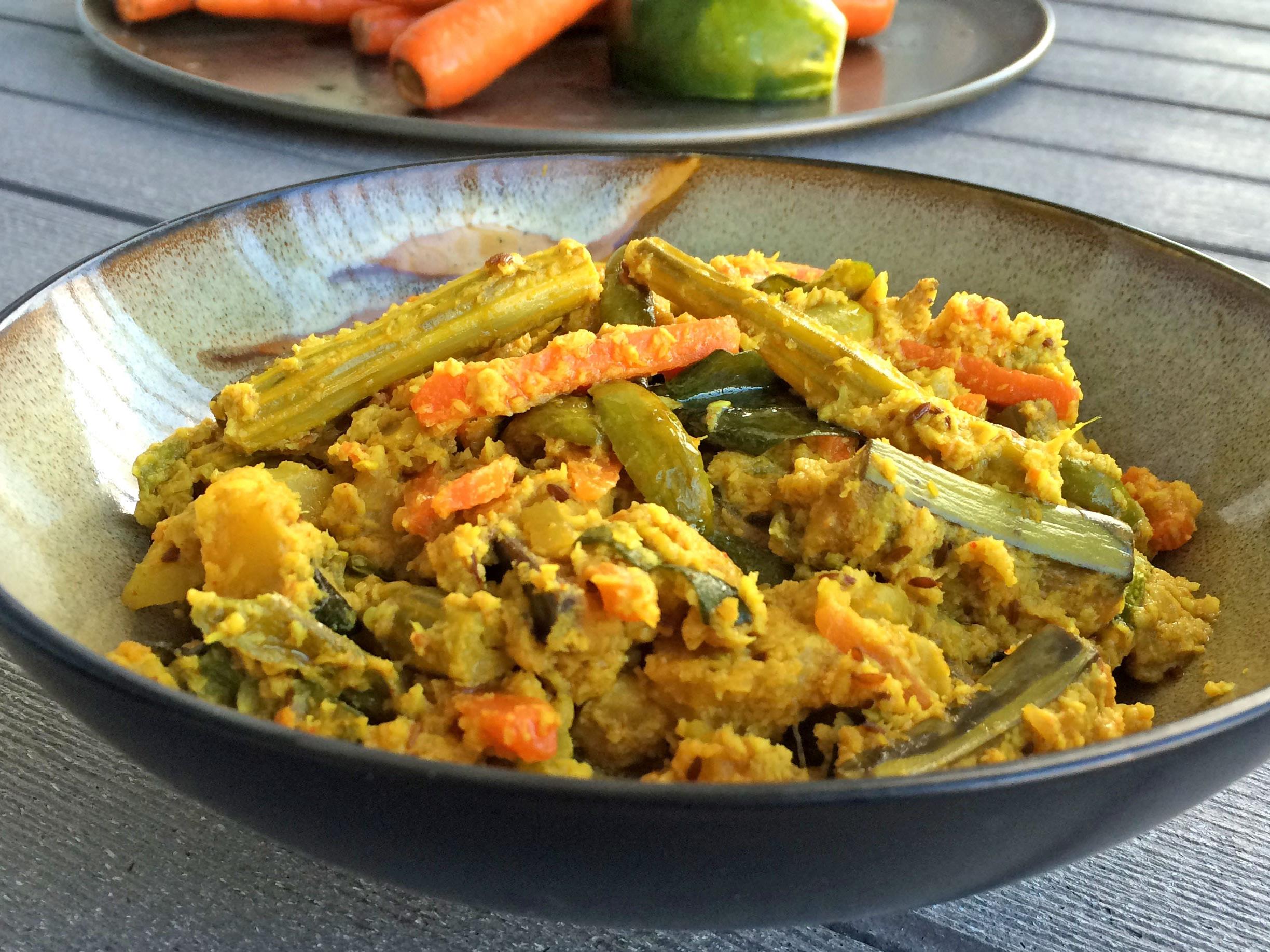 a bowl of south indian mixed vegetables with coconut