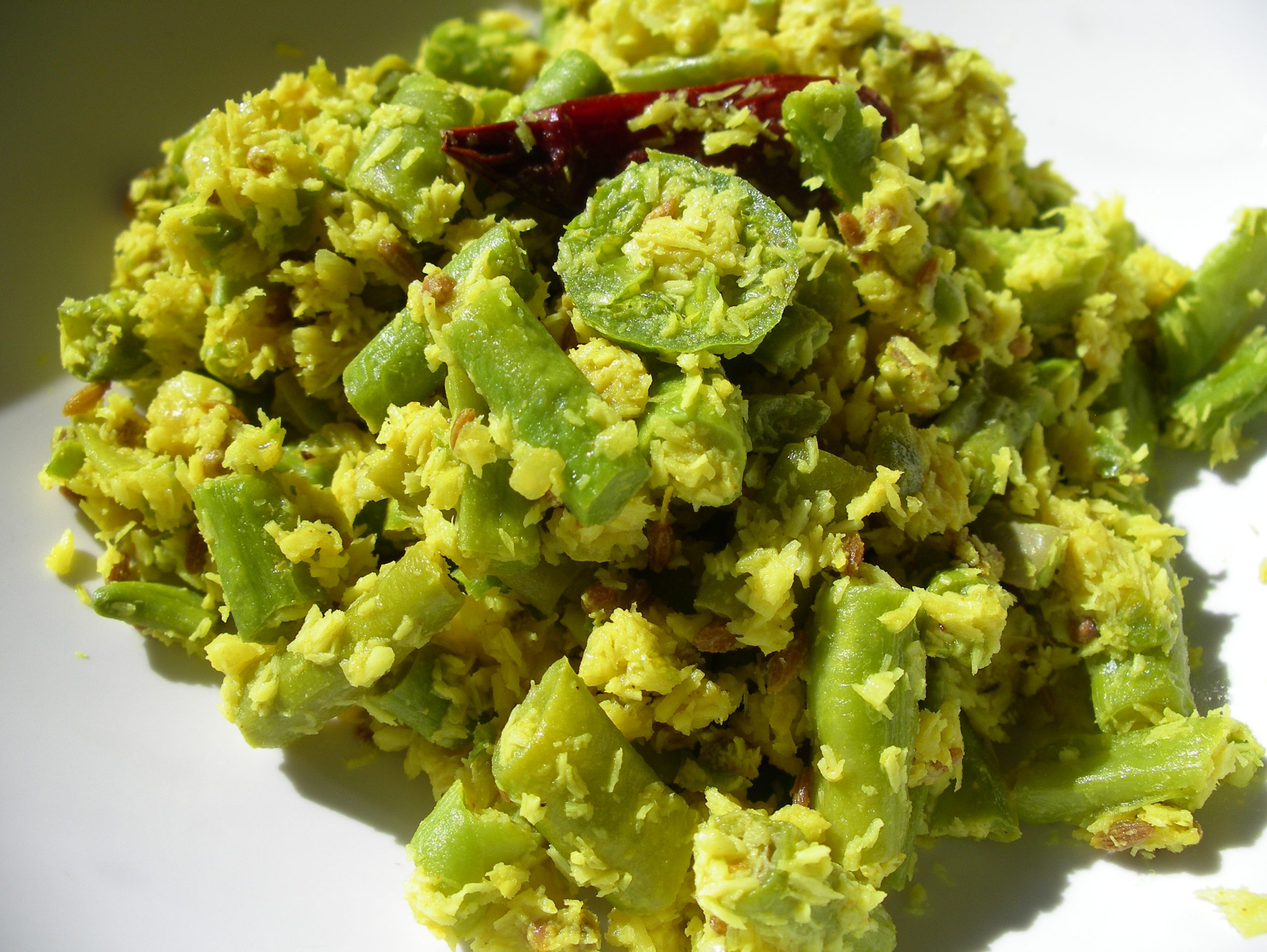 a mound of beans with coconut