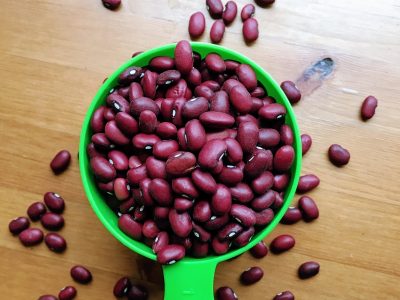 A measuring cup of red kidney beans