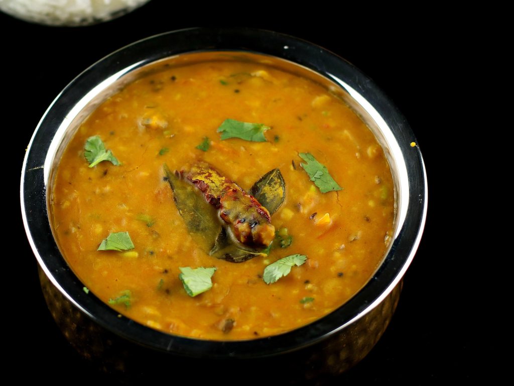 a serving bowl with Bengali dal