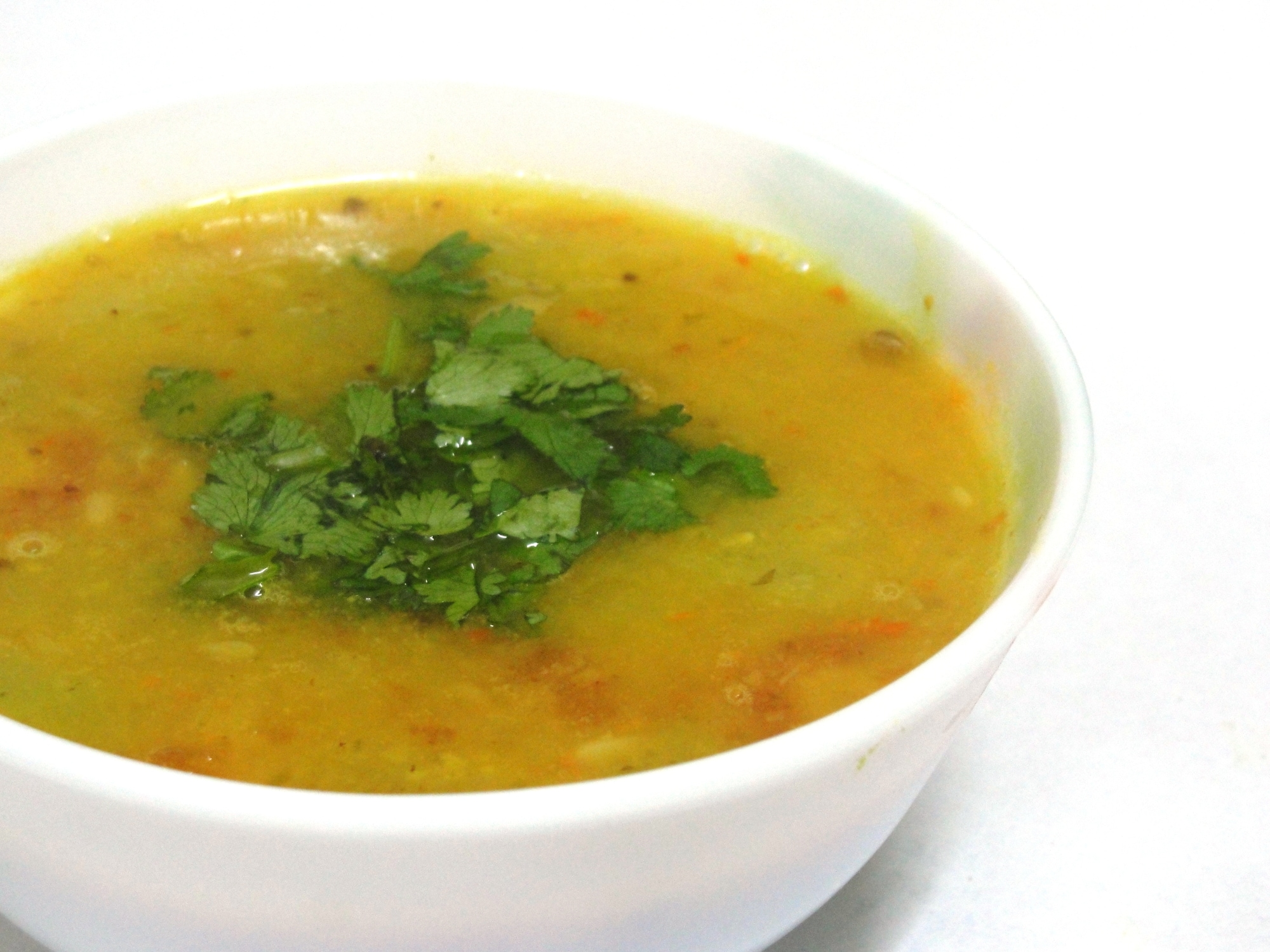 a serving bowl of yellow dal
