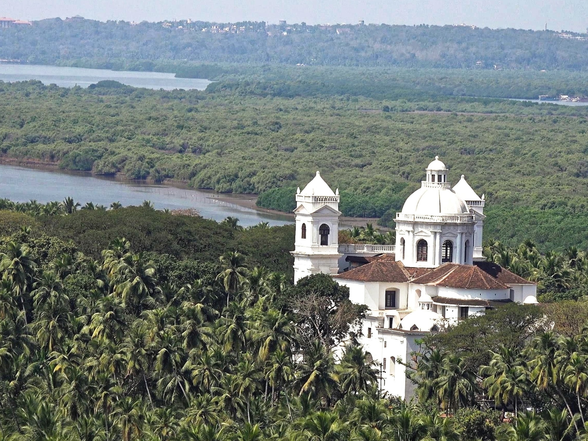 Portuguese colonial church set in tropical Goan landscape