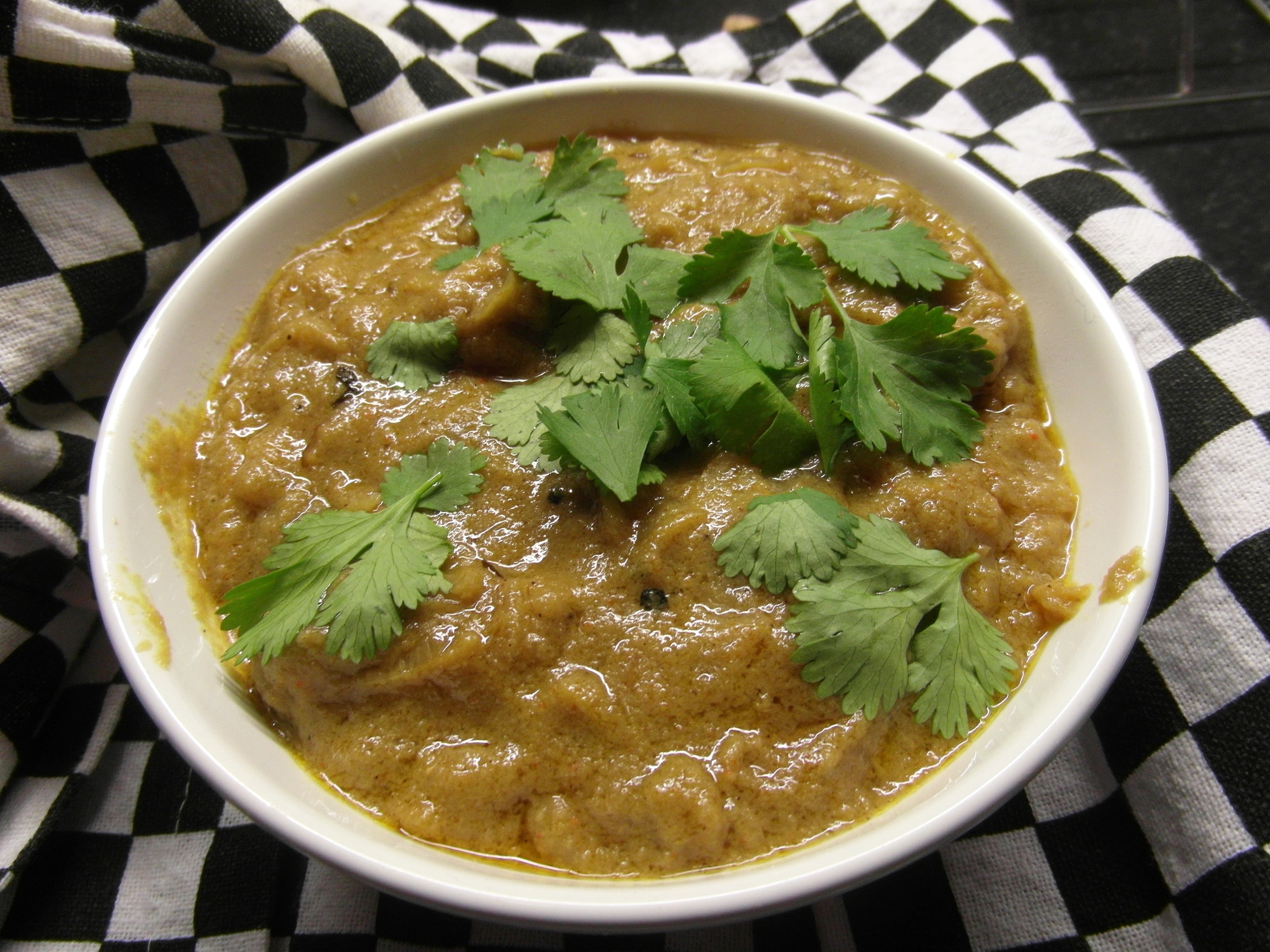 a serving bowl of lamb dopiaza
