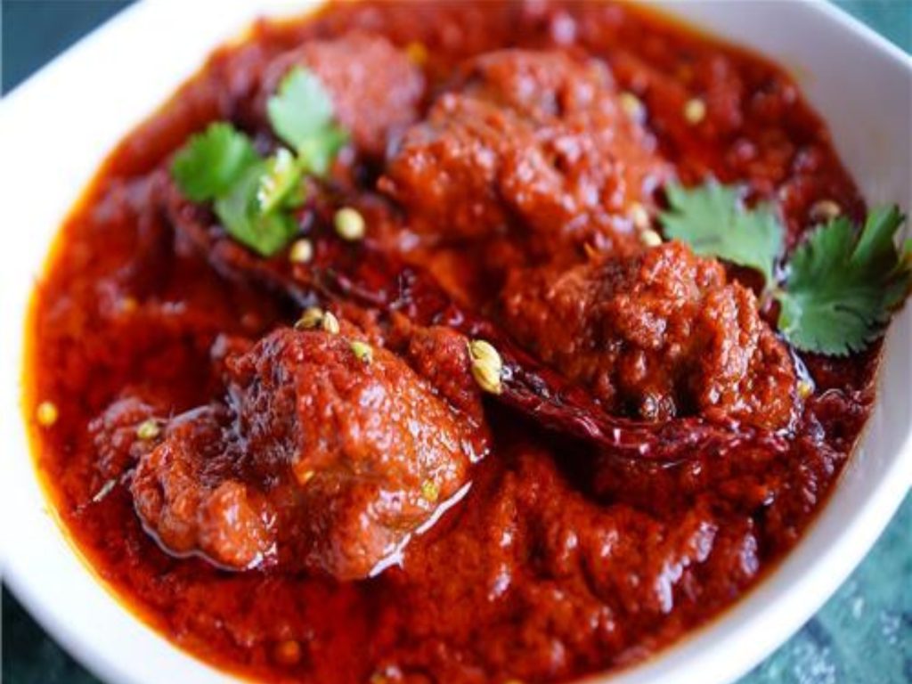 A bowl of rajasthani red lamb curry