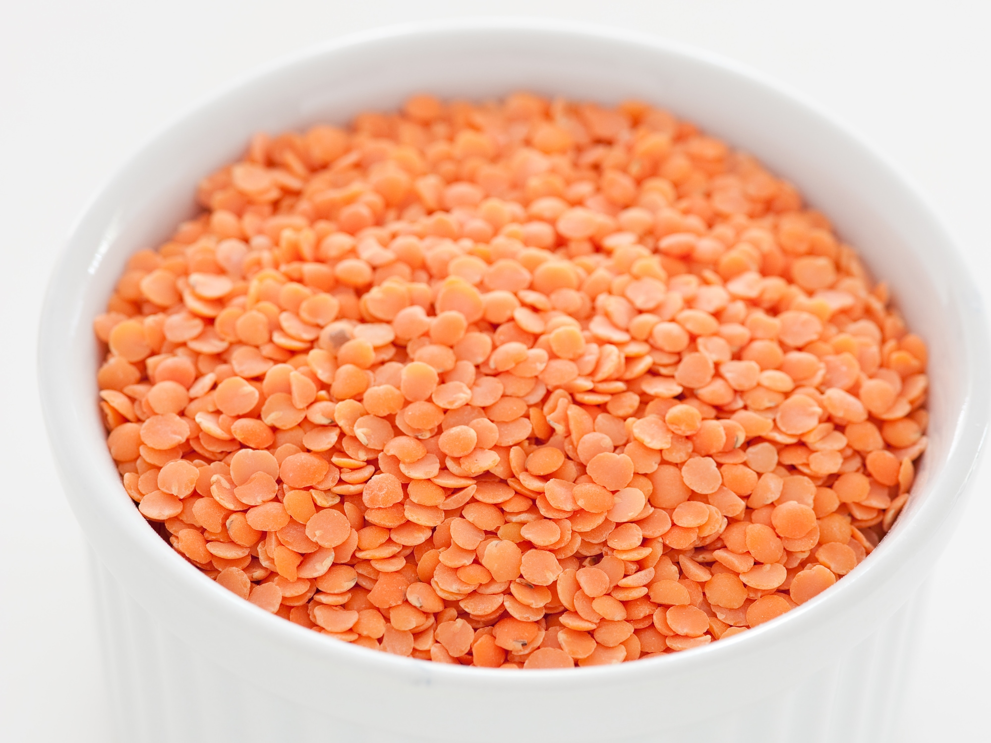 A bowl of uncooked split red lentils