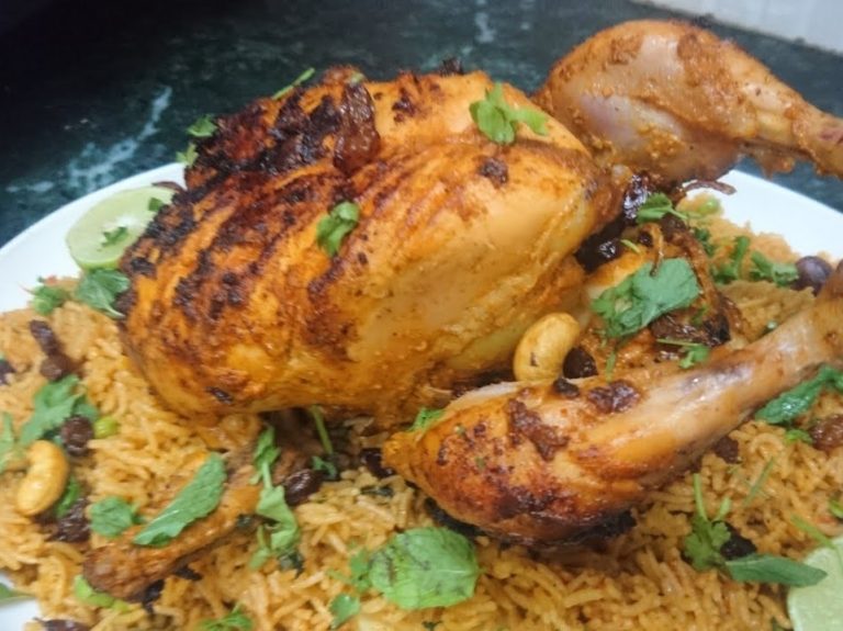 roast chicken on a bed of rice.