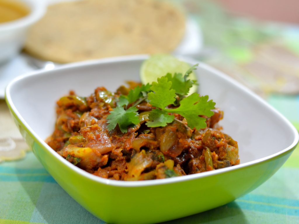 a serving bowl of mushroom dopiaza