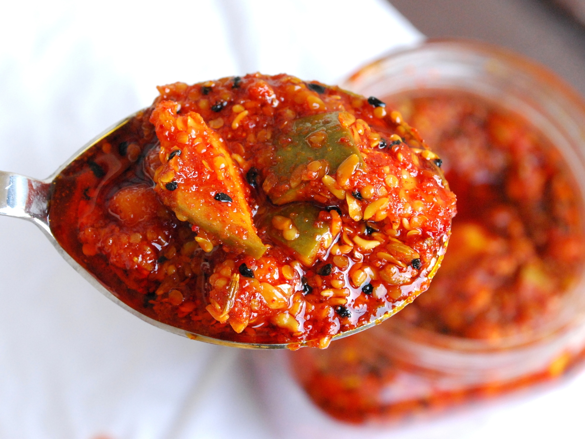 a serving spoon of grated mango pickle