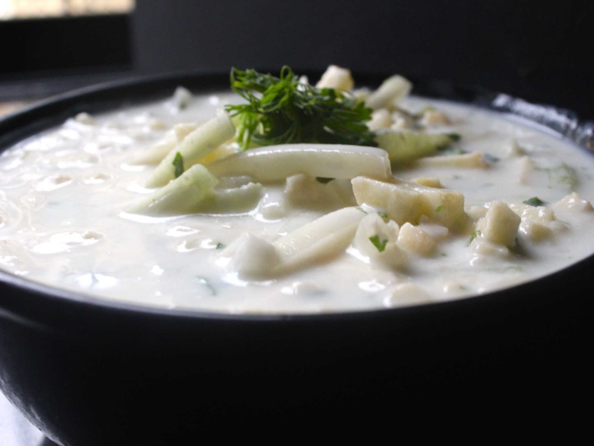 A bowl of grated green apple raita