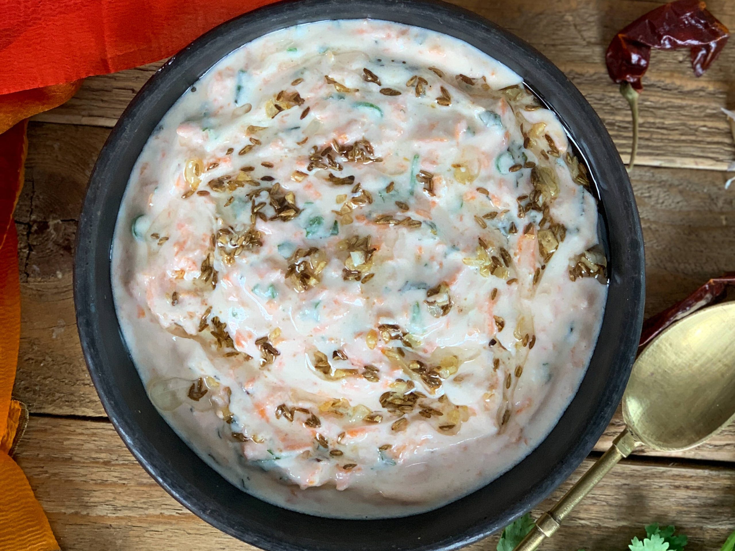 a serving bowl of carrot raita