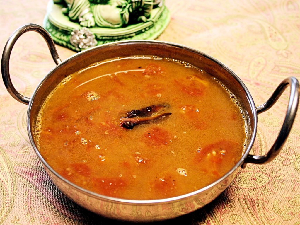 a bowl of tomato and lentil rasam